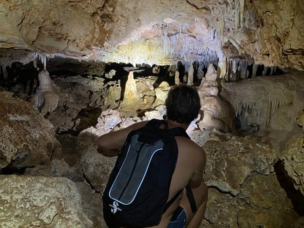 Inside a cave on Bonaire with stalactites and rock formations